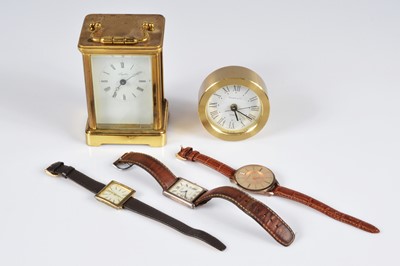Lot 55 - A Tiffany & Co quartz alarm clock together with three watches and a brass quartz carriage timepiece