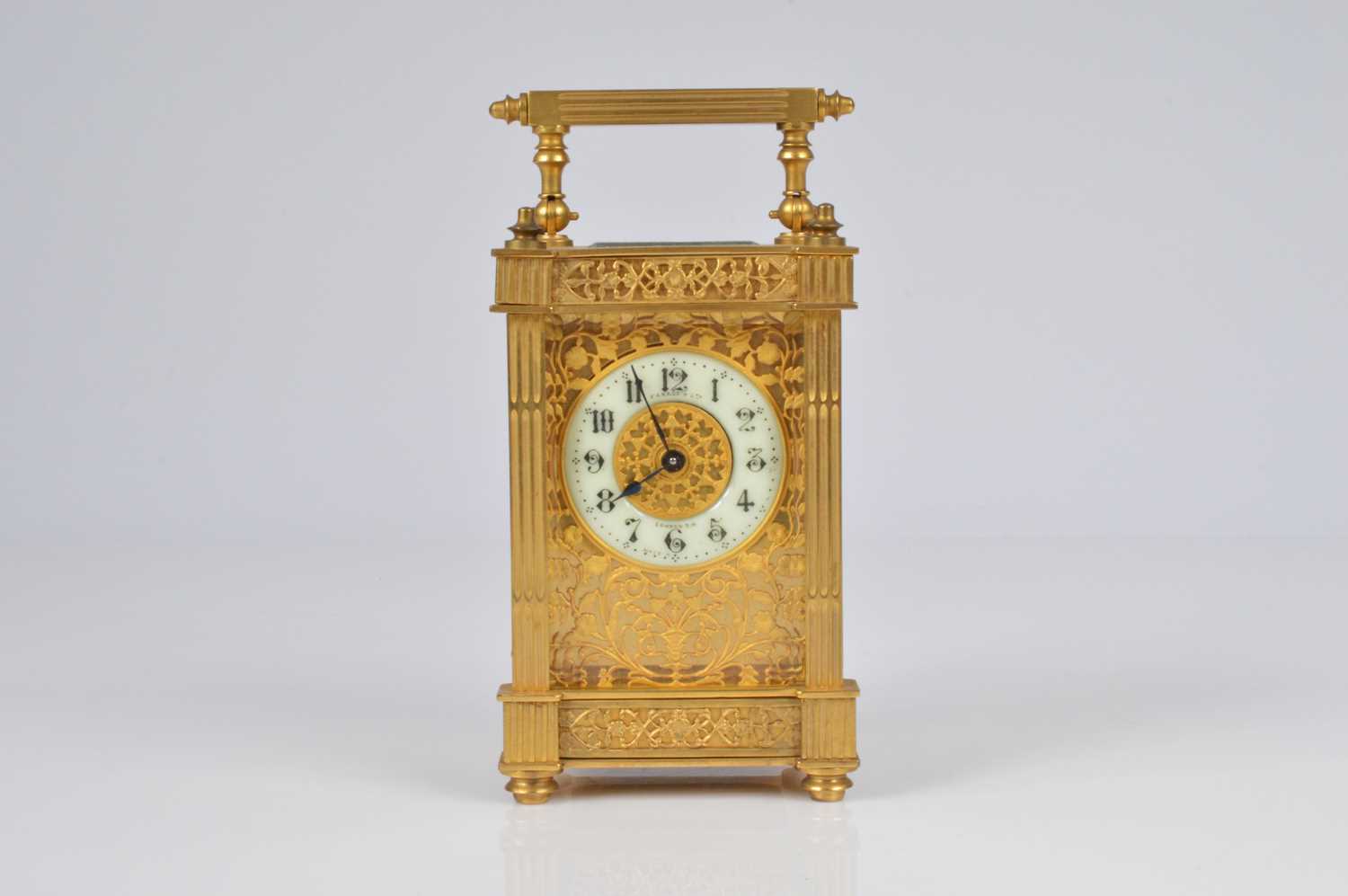 Lot 64 - A pretty early 20th century French brass carriage timepiece