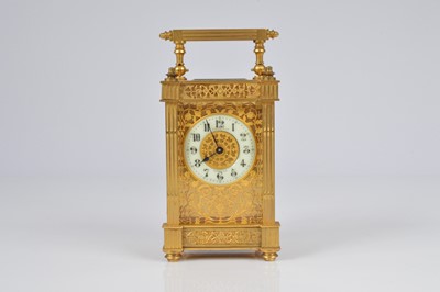 Lot 64 - A pretty early 20th century French brass carriage timepiece