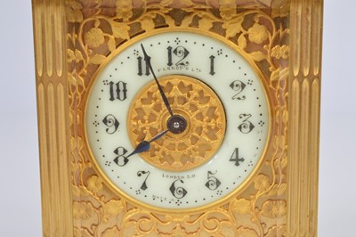 Lot 64 - A pretty early 20th century French brass carriage timepiece