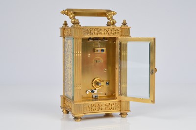 Lot 64 - A pretty early 20th century French brass carriage timepiece
