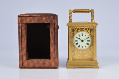 Lot 65 - An early 20th century brass carriage timepiece