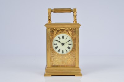 Lot 65 - An early 20th century brass carriage timepiece