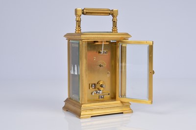 Lot 65 - An early 20th century brass carriage timepiece