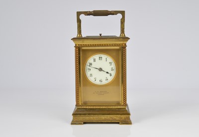 Lot 66 - An early 20th century brass repeater carriage timepiece