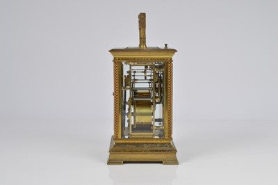 Lot 66 - An early 20th century brass repeater carriage timepiece