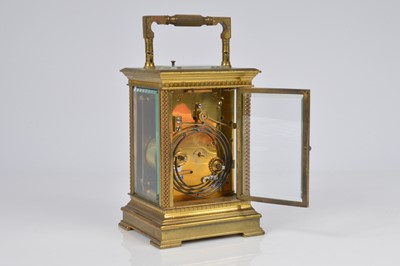 Lot 66 - An early 20th century brass repeater carriage timepiece