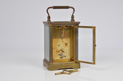 Lot 67 - An early 20th century brass carriage timepiece