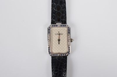 Lot 176 - A 1990s Corum 18ct gold and gem set cocktail dress wristwatch