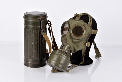 Lot 8 - A WWII German Gas Mask and Carry Cannister