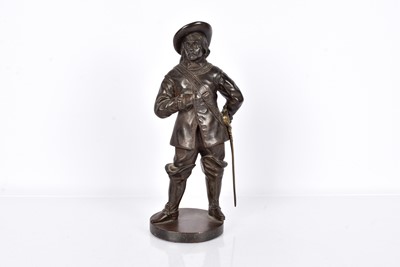Lot 61 - A cast iron figure of a Musketeer