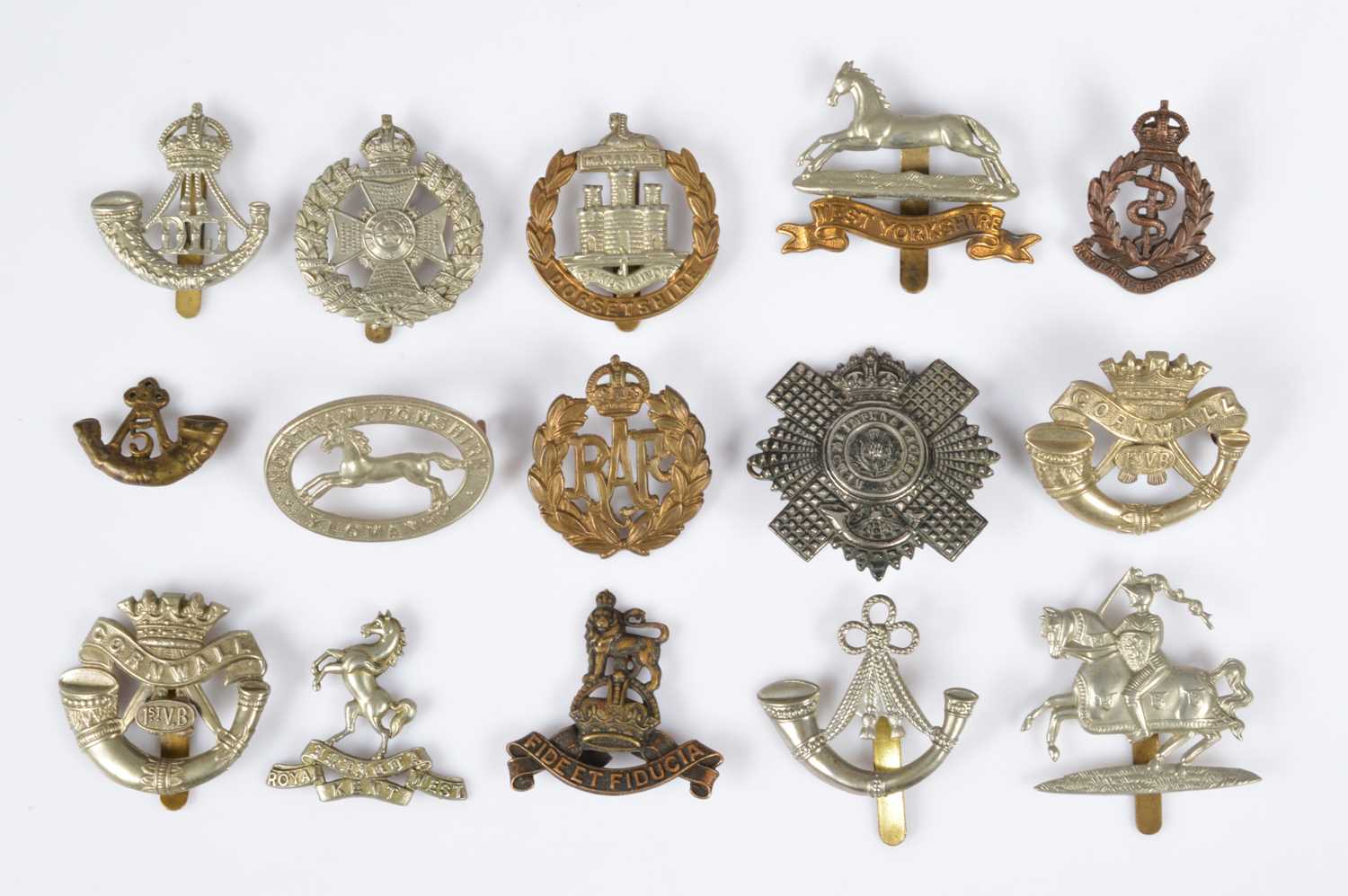 Lot 151 - A group of cap badges