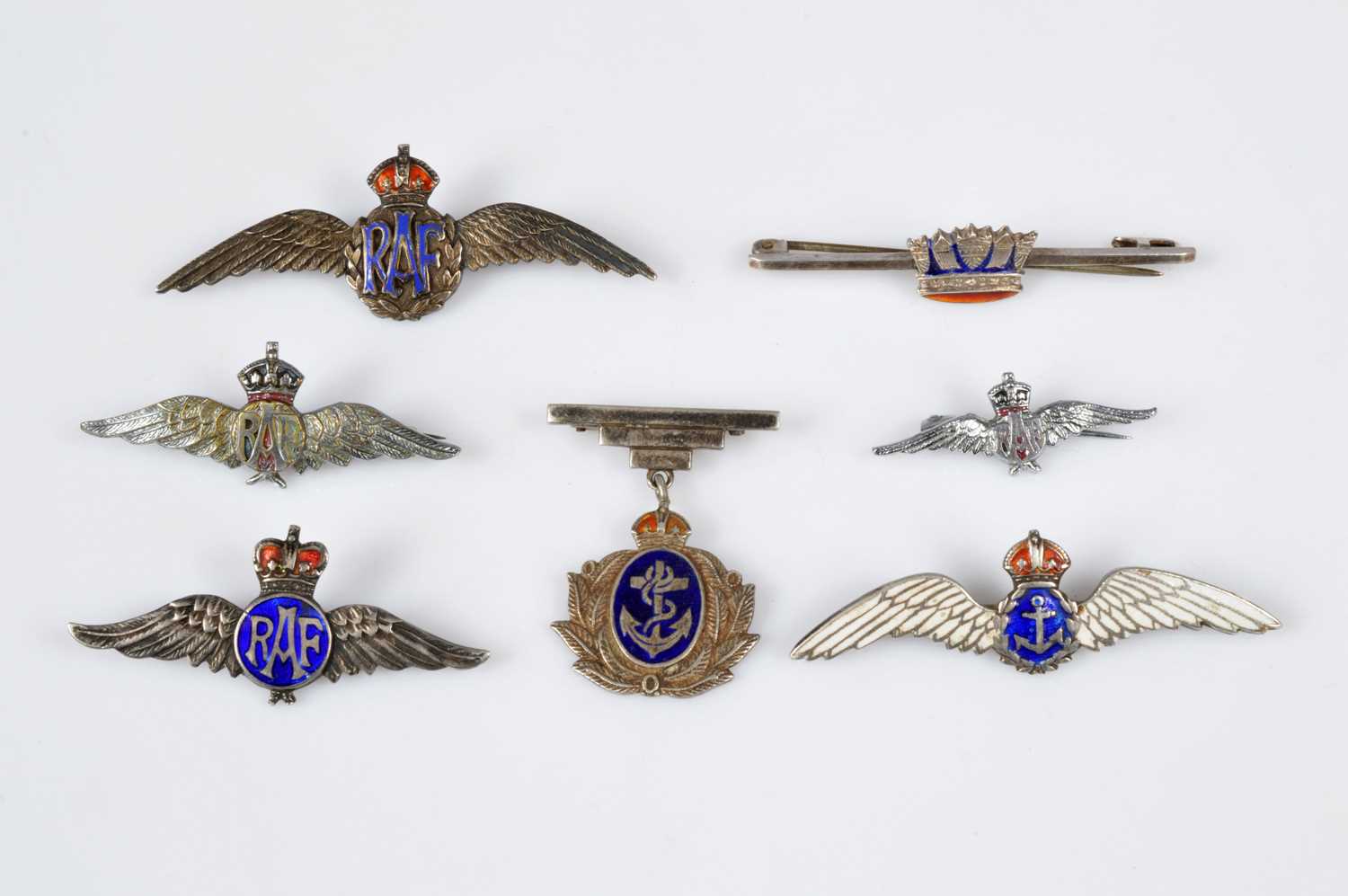 Lot 156 - A group of five Sterling Silver Royal Air Force and Naval Sweetheart Brooches