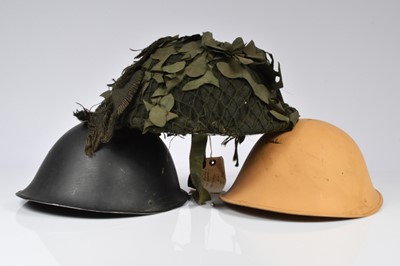 Lot 352 - A collection of three 'turtle' combat helmets