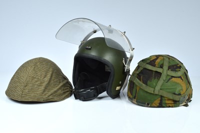 Lot 354 - A collection of three British and Czechoslovakia military helmets