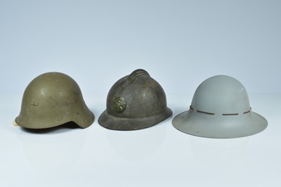 Lot 355 - A WWII British Zuckerman and two European military helmets
