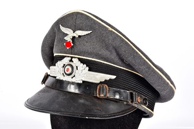 Lot 396 - A WWII German Luftwaffe Officer's peaked Cap