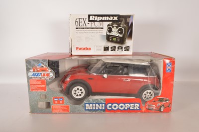Lot 506 - Toys are Us Fast lane approx 1/6 scale Mini Cooper Remote Control with Remote control and separate Ripmax 6EXAP-FM40 Remote Control (2)