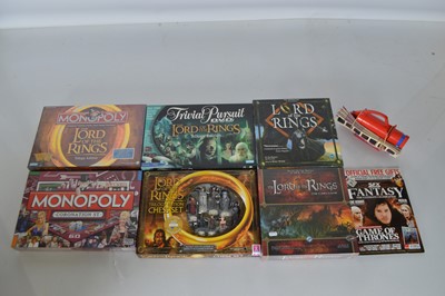 Lot 518 - Collection of boxed modern games including two Monopoly Sets and Lord of the Rings Games and unboxed Chad Valley Projector and Game of Thrones Magazine (8)