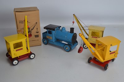 Lot 524 - Three Sutcliffe Junior pressed steel yellow Cranes (one boxed) and Tri-ang pressed steel Express Puffer Engine (4)