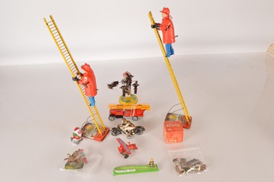 Lot 526 - Various Tinplate and other metal toys including pair of clockwork Marx Climbing Fireman and Paya Motorcycle and Wild West Tin whistles and clickers (16)