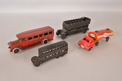 Lot 535 - Brimtoy tin and plastic articulated Esso Tanker and three Cast Iron buses (4)