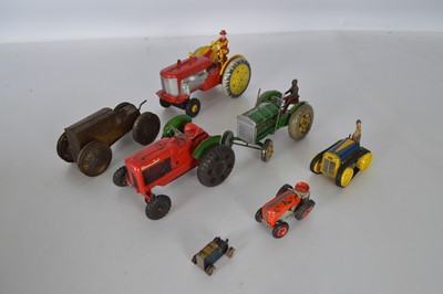 Lot 538 - Collection of mostly 1950-60's Tinplate and plastic  clockwork and battery Tractors by various makers (7)