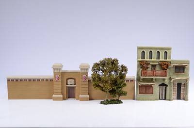 Lot 728 - Street facades and a tree by J. G. Miniatures comprising VR gateway, and flag-bedecked walls (2)