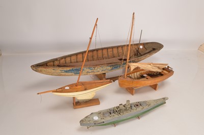 Lot 767 - Large Wooden distressed Model rowing/sailing  boat two Pond Yachts and plastic kitbuilt Warship (4)