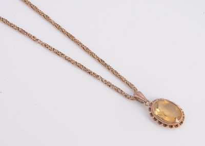 Lot 9 - A 9ct gold necklace with yellow stone pendant