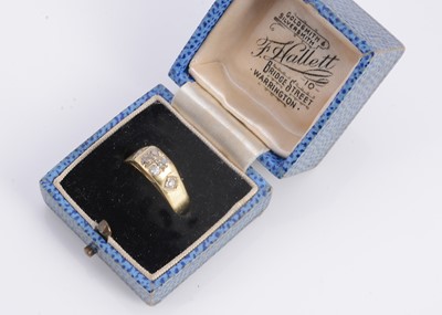 Lot 12 - An 18ct yellow gold diamond set dress ring