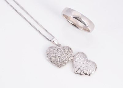 Lot 16 - An silver wedding band, a silver pave set CZ heart pendant on chain