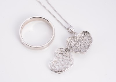 Lot 16 - An silver wedding band, a silver pave set CZ heart pendant on chain