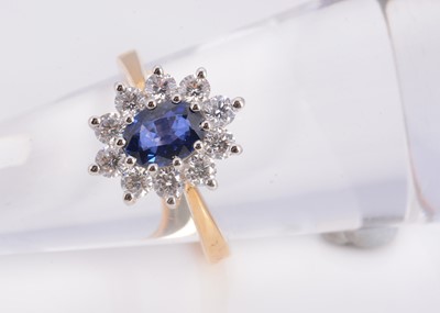 Lot 17 - A 18ct gold sapphire & diamond cluster ring