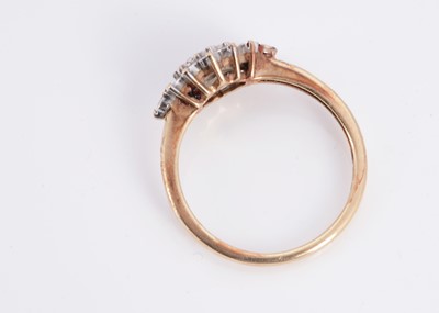 Lot 18 - A 9ct gold cluster diamond dress ring