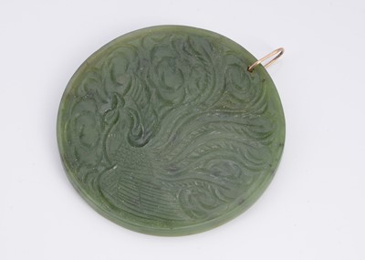 Lot 26 - A nephrite jade double sided carved medallion pendant