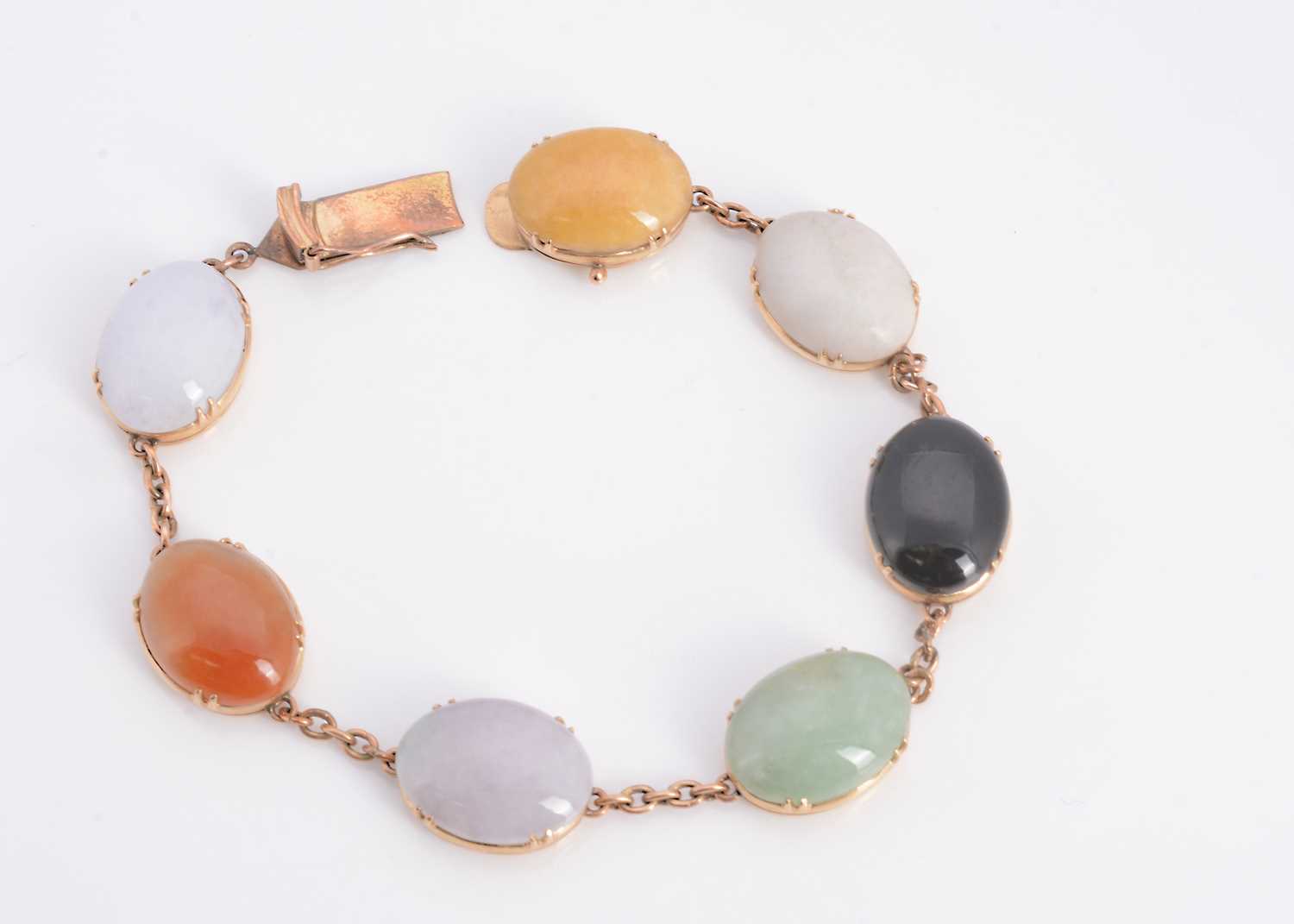 Lot 40 - A yellow metal seven hard stone bracelet