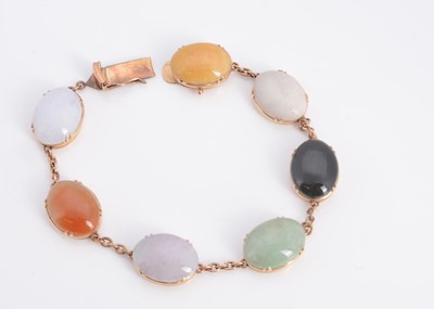 Lot 40 - A yellow metal seven hard stone bracelet