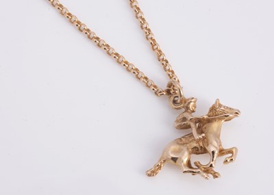Lot 48 - A 9ct gold necklace with horse & jockey pendant