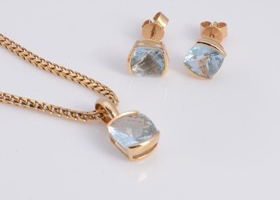 Lot 60 - A 18ct gold aquamarine cushion shaped pendant necklace & matching aquamarine stud earrings
