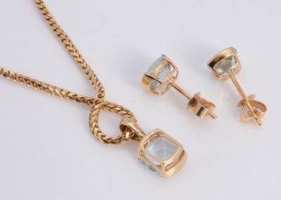 Lot 60 - A 18ct gold aquamarine cushion shaped pendant necklace & matching aquamarine stud earrings