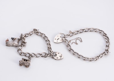 Lot 68 - A silver curb bracelets with padlocks