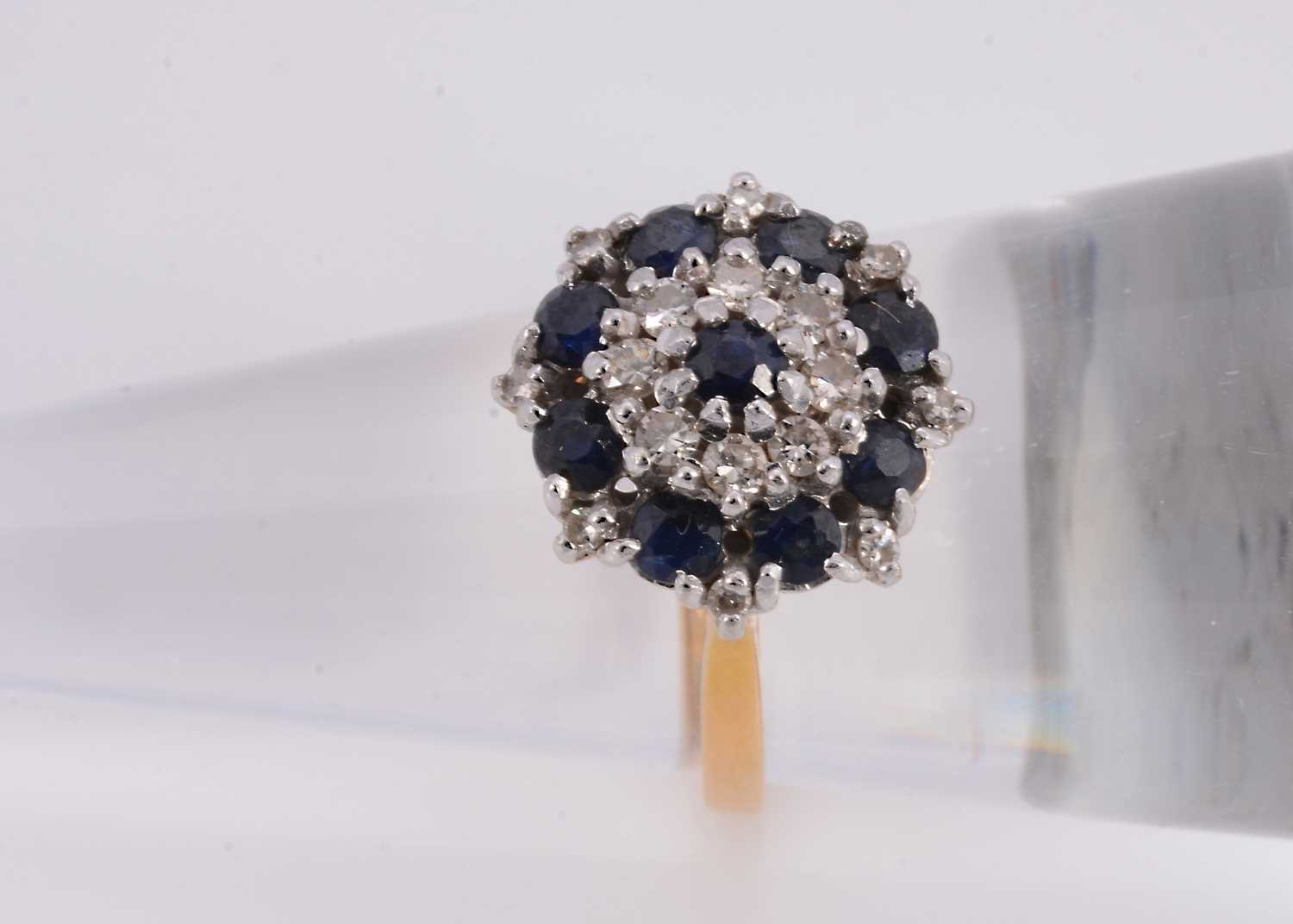 Lot 75 - A 18ct sapphire & diamond cluster ring