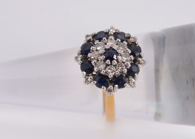 Lot 75 - A 18ct sapphire & diamond cluster ring
