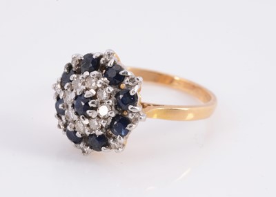 Lot 75 - A 18ct sapphire & diamond cluster ring
