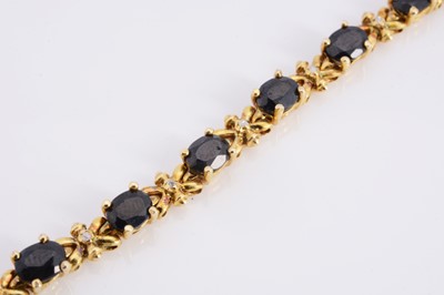 Lot 95 - A silver gilt sapphire set line bracelet