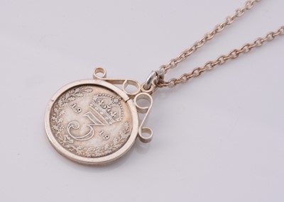 Lot 107 - A silver six pence mounted pendant necklace