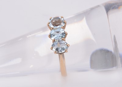 Lot 112 - A 9ct gold 3 stone aquamarine dress ring