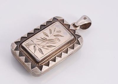 Lot 117 - A silver engraved rectangle locket