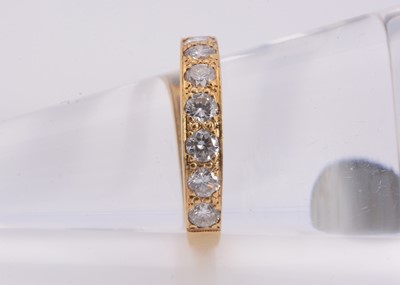 Lot 120 - A 18ct gold seven diamond half eternity ring